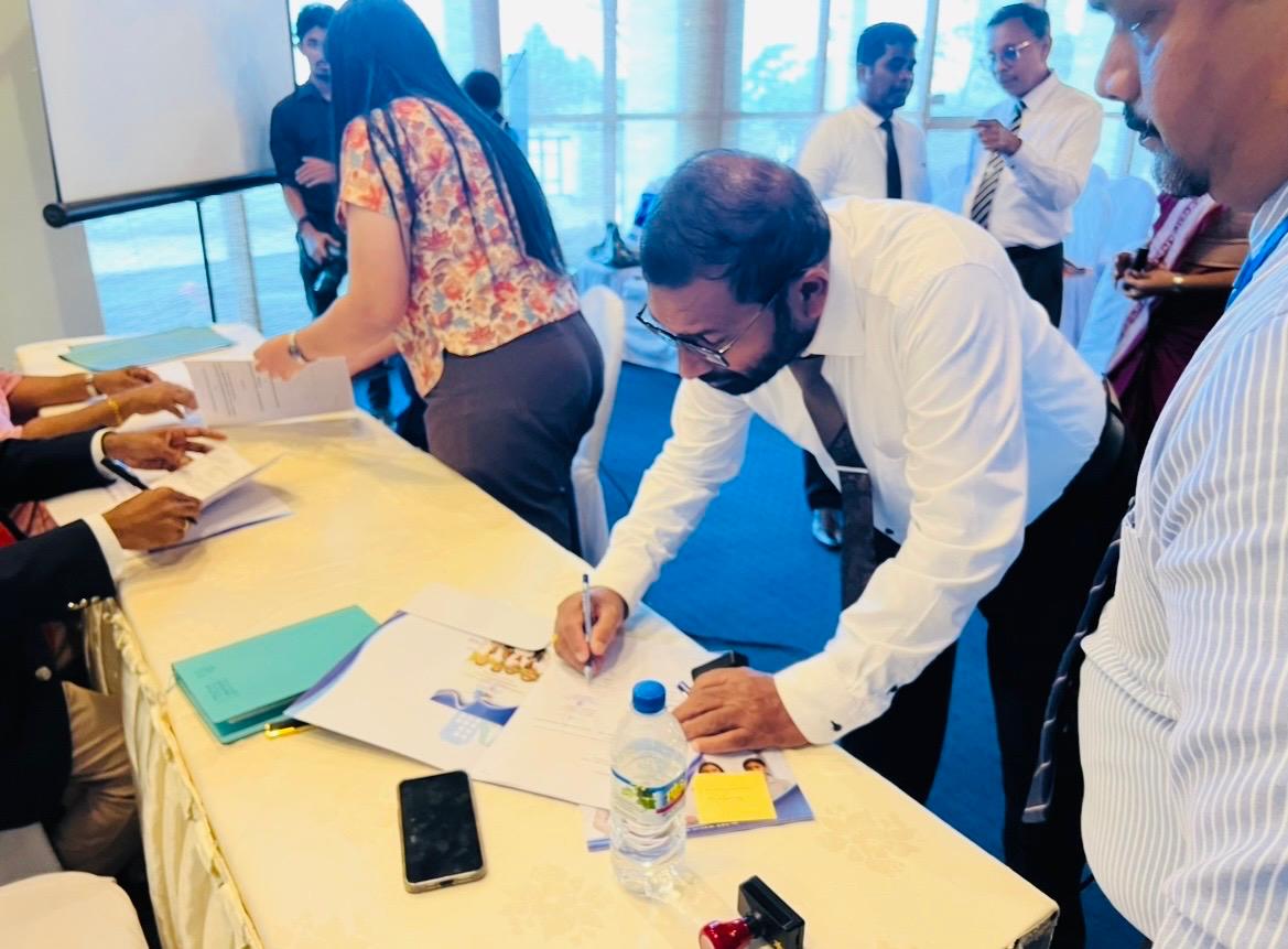 Officials signing the NVQ Level 3 programme agreement